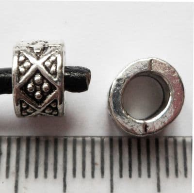 Tibetan Silver bead with 4.7mm hole. 8mm diam. 5mm wide