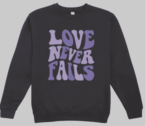 Love Never Fails Purple text sweatshirt