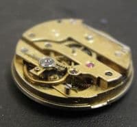 LE COUltre & Co Movement with dial and a hand