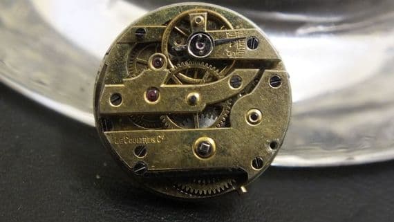 LE COUltre & Co Movement with dial and a hand