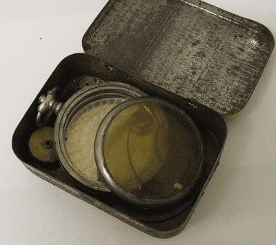 Tin of workshop parts pocket watch