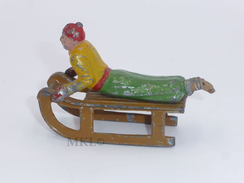 Vintage Lead Figure - Person Lying on Sled