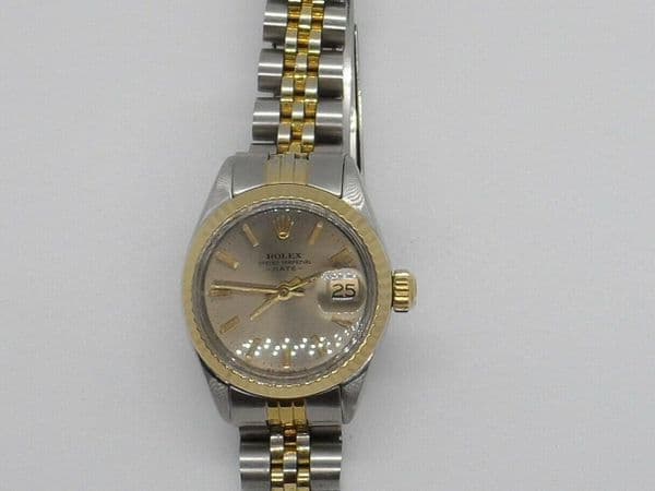 Q216 Ladies 18k gold and steal rolex oyster date watch with papers near mint