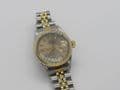 Q216 Ladies 18k gold and steal rolex oyster date watch with papers near mint