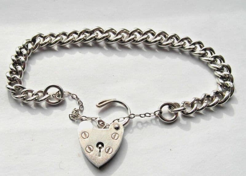 traditional vintage charm bracelet hallmarked on every link with heart padlock