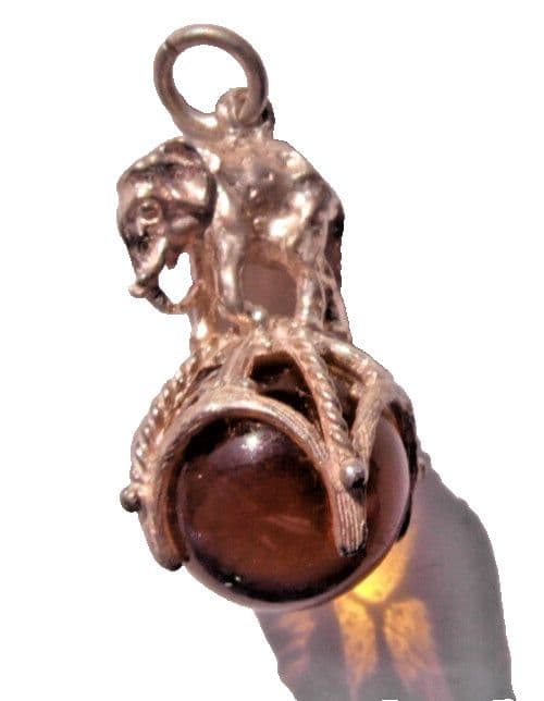 vintage charm of a circus elephant on orange quartz sphere for a charm bracelet