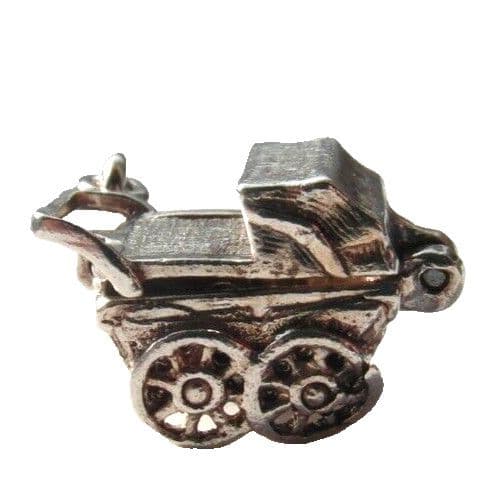 vintage silver charm of a pram opening to reveal baby inside for charm bracelet