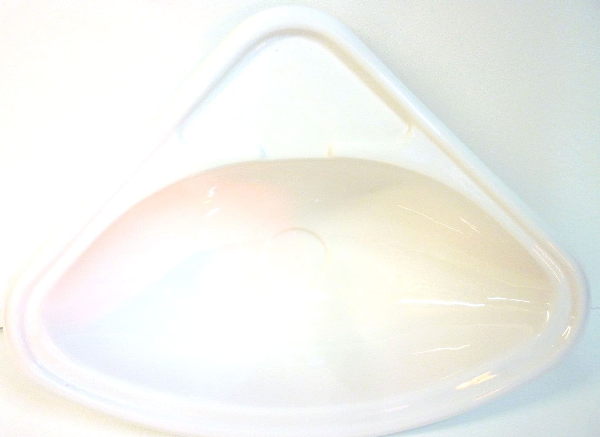 White triangular bathroom sink