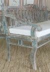 antique indian teak wood bench with faded paint tones & cushion