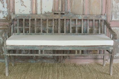 antique indian teak wood bench with faded paint tones & cushion