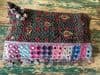 antique textile bag with mirror work and coins