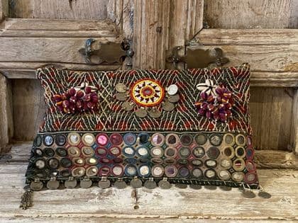 Antique textile bag with mirrors and coins
