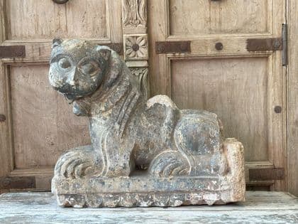 architectural statue of a lion from the parapet of a durga temple , gujarat
