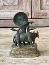 Bronze Casting of Lord Krishna, God of Love with a Nandi Cow