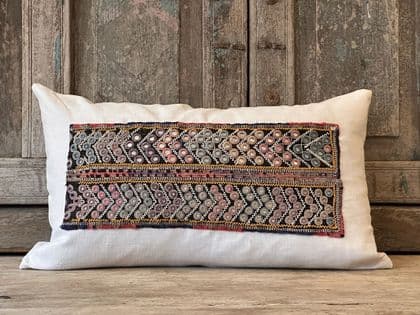 Cushion made from an antique mirrored embroidery with French linen