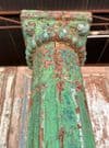 Decorative teak pillars with green paint tones & sandstone bases, circa 1890, Gujarat