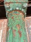 Decorative teak pillars with green paint tones & sandstone bases, circa 1890, Gujarat