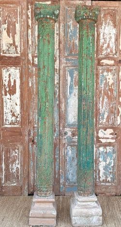 Decorative teak pillars with green paint tones & sandstone bases, circa 1890, Gujarat
