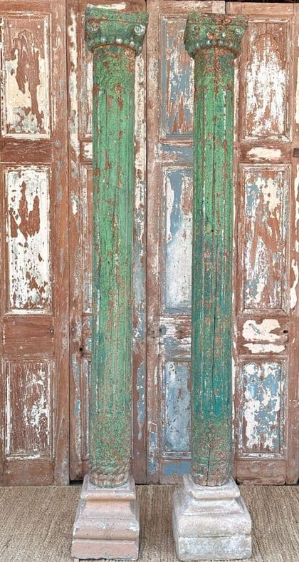 Decorative teak pillars with green paint tones & sandstone bases, circa 1890, Gujarat