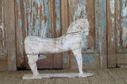 Early 20th century stylised carving in teak of a horse (one of a pair sold separately)
