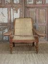 Early 20th century teak colonial planters chair with rattan weave
