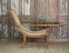 Early 20th century teak colonial planters chair with rattan weave