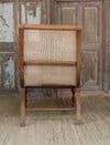 Early 20th century teak colonial planters chair with rattan weave