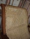 Early 20th century teak colonial planters chair with rattan weave