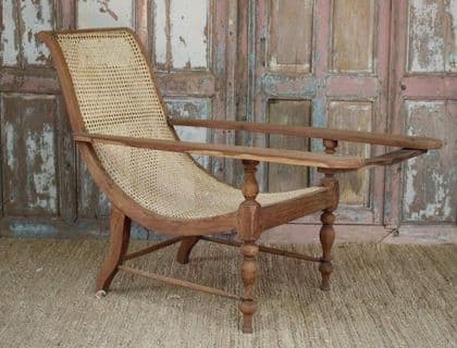 Early 20th century teak colonial planters chair with rattan weave