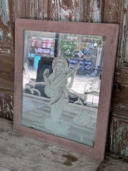 Etched glass mirror depicting the Hindu deity Saraswati playing a veena