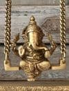 Golden Brass Ganesha on a swing with decorative peacocks