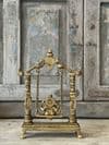 Golden Brass Ganesha on a swing with decorative peacocks