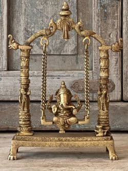 Golden Brass Ganesha on a swing with decorative peacocks
