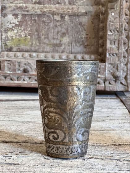 vintage lassi cup with decorative etchings