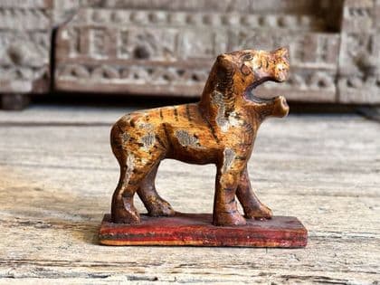 Vintage polychrome wooden tiger, avatar of goddess Durga