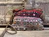 vintage textile bag with mirrorwork, cowrie shells and rupee coin embellishments