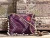 Vintage textiles bag with cowrie shells