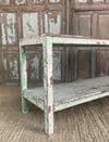 wooden antique printers table with faded paint tones