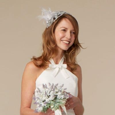 Silver lace head dress with feather and pearl
