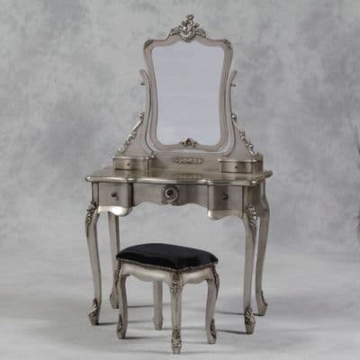 A Dressing Table Set in Antique Silver