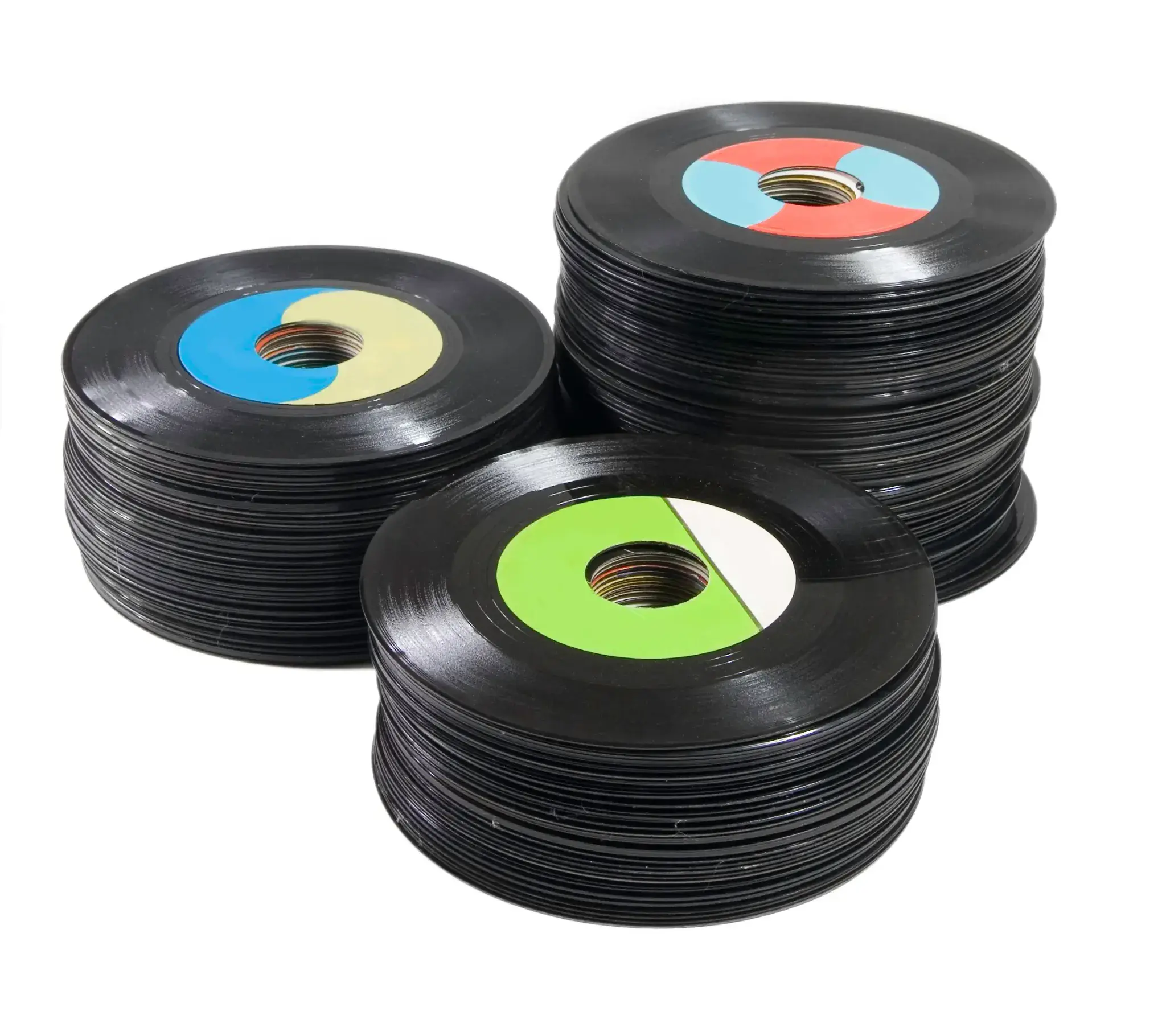 A pile of Fair condition records showing heavy wear, scratches, and missing covers.