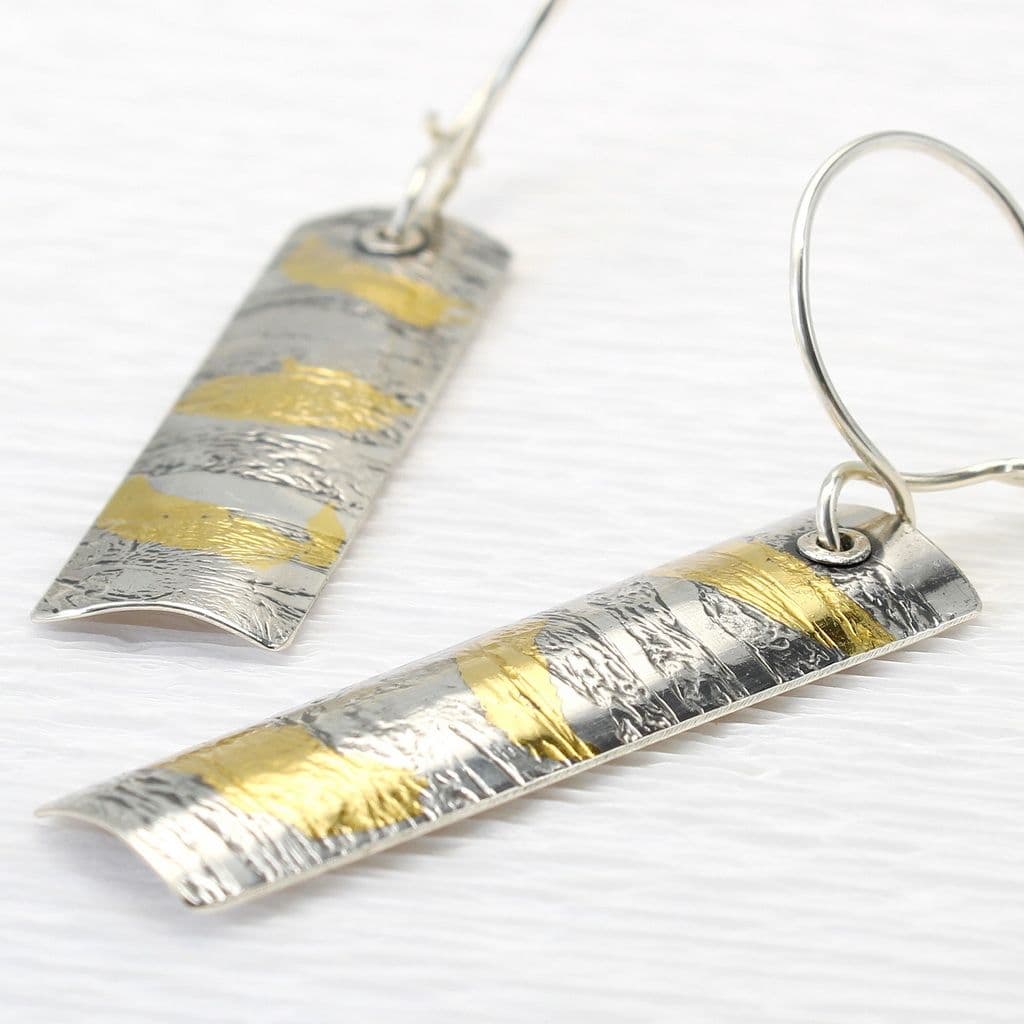 A pair of Keum boo sterling silver and gold Razor shell earrings. Long earrings with an embossed texture resembling natural rasor shells