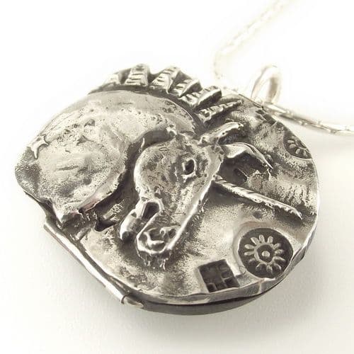 A unique, beautifully sculpted Unicorn decision maker pendant