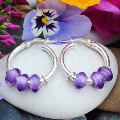 Amethyst sleeper earrings, three stones