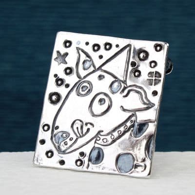 Dog brooch, polished silver