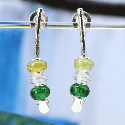 Handmade green gemstone arc earrings featuring green jade and rainbow crystal. S.
