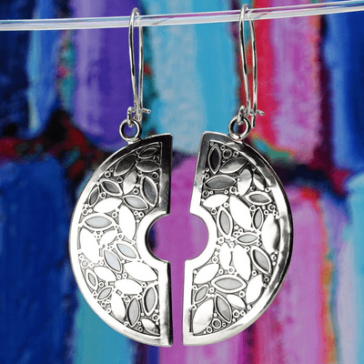 Handmade Leaf pattern halved earrings, made from sterling silver with embossed leave and berries