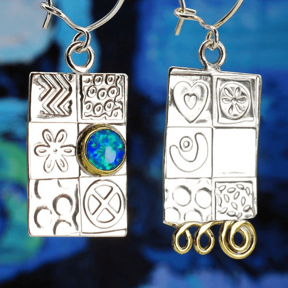 Handmade sterling silver asymmetrical earrings, featuring a blue Opal gemstone, embossed silver.  .