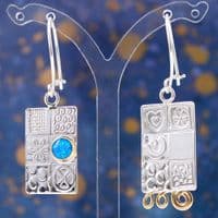 Handmade sterling silver asymmetrical earrings, featuring a blue Opal gemstone, embossed silver.  .