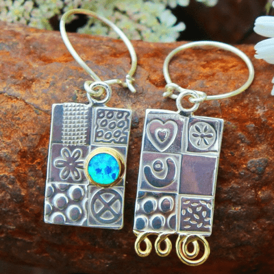 Handmade sterling silver asymmetrical earrings, featuring a blue Opal gemstone, embossed silver.  .